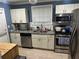 Well-equipped kitchen with stainless steel appliances and granite countertops at 2447 Hillside Ave, Decatur, GA 30032