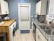 Modern kitchen with stainless steel appliances, granite countertops, and ample cabinet space at 2447 Hillside Ave, Decatur, GA 30032