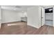 Finished basement area with modern wet bar, garage access, and updated flooring at 3905 Mill Glen Dr, Douglasville, GA 30135