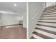 Finished basement with wood-look floors, white walls, and recessed lighting at 3905 Mill Glen Dr, Douglasville, GA 30135