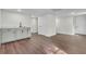 Finished basement area with modern wet bar and updated flooring at 3905 Mill Glen Dr, Douglasville, GA 30135