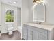 Bathroom with modern vanity, sleek fixtures, and a beautiful mirror at 3905 Mill Glen Dr, Douglasville, GA 30135