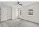 Comfortable bedroom featuring plush carpeting, two windows, and a door for easy access at 3905 Mill Glen Dr, Douglasville, GA 30135