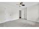 Spacious bedroom with neutral carpet, ceiling fan, and fresh, neutral paint at 3905 Mill Glen Dr, Douglasville, GA 30135