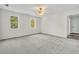 Airy bedroom features plush carpeting and a scenic view from multiple windows at 3905 Mill Glen Dr, Douglasville, GA 30135