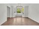 Bright dining room with hardwood floors, modern light fixture, and a view of the street at 3905 Mill Glen Dr, Douglasville, GA 30135