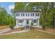 Charming two-story home with a well-maintained front yard and lush landscaping at 3905 Mill Glen Dr, Douglasville, GA 30135
