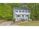 Charming two-story home with a well-maintained front yard and lush landscaping at 3905 Mill Glen Dr, Douglasville, GA 30135