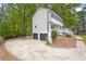 Charming two-story home featuring a white exterior, black trim, and a well-maintained driveway at 3905 Mill Glen Dr, Douglasville, GA 30135