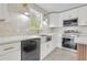 Bright kitchen featuring stainless steel appliances, white cabinets, and stylish lighting at 3905 Mill Glen Dr, Douglasville, GA 30135