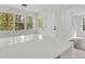 Bright, modern kitchen featuring a white countertop island with natural wood accents at 3905 Mill Glen Dr, Douglasville, GA 30135