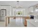 Bright, modern kitchen with stainless steel appliances, and a large center island at 3905 Mill Glen Dr, Douglasville, GA 30135