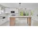 Bright, modern kitchen with stainless steel appliances, and a large center island at 3905 Mill Glen Dr, Douglasville, GA 30135