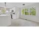 Modern kitchen with stainless appliances, stone backsplash, and big windows overlooking a green backyard at 3905 Mill Glen Dr, Douglasville, GA 30135