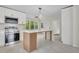 Bright, modern kitchen with stainless steel appliances, and a large center island at 3905 Mill Glen Dr, Douglasville, GA 30135