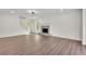 Open living room with hardwood floors, a fireplace, and staircase at 3905 Mill Glen Dr, Douglasville, GA 30135