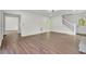 Bright living room features hardwood floors and ample natural light from a front door and adjacent staircase at 3905 Mill Glen Dr, Douglasville, GA 30135