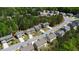 Overhead angle of residential neighborhood featuring lush trees in a sought-after community at 401 Daffodil Dr, Temple, GA 30179