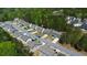 Scenic aerial view of a new home community showcasing tree-lined streets and manicured lawns at 401 Daffodil Dr, Temple, GA 30179