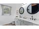 Bright bathroom featuring double sinks with marble countertops and modern fixtures at 401 Daffodil Dr, Temple, GA 30179