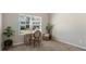 Cozy bedroom with a window view and an elegant wooden desk and floral chair at 401 Daffodil Dr, Temple, GA 30179