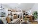Bright and airy living room with hardwood floors, a stylish kitchen, and comfortable furniture at 401 Daffodil Dr, Temple, GA 30179