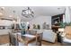 Open concept living space features modern furnishings and a fireplace with built-in shelving at 401 Daffodil Dr, Temple, GA 30179
