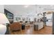Open-concept living space featuring hardwood floors, a modern kitchen, and comfortable seating areas at 401 Daffodil Dr, Temple, GA 30179