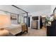 Well-lit main bedroom boasts modern decor, a four-poster bed, and a calming atmosphere at 401 Daffodil Dr, Temple, GA 30179