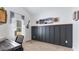 Home office with built-in paneling, a large window, and neutral carpeting at 401 Daffodil Dr, Temple, GA 30179