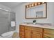 Bathroom with a double vanity, shower, and tiled floor at 5830 Wills Wood Cir, Cumming, GA 30040