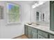 Bathroom with a modern vanity, mirror, and tiled floor at 5830 Wills Wood Cir, Cumming, GA 30040
