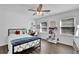 Bright bedroom with modern furnishings, hardwood floors, and lots of natural light at 5830 Wills Wood Cir, Cumming, GA 30040