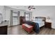 Bedroom with a dark wood floor, windows with mini-blinds, and ceiling fan at 5830 Wills Wood Cir, Cumming, GA 30040