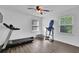 Exercise room equipped with a treadmill, trampoline, and natural light at 5830 Wills Wood Cir, Cumming, GA 30040