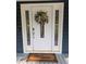 Elegant white front door with decorative glass and a floral wreath, creating a warm welcome at 5830 Wills Wood Cir, Cumming, GA 30040
