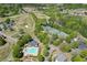 Gorgeous aerial view showcases the pool, tennis courts, golf course and clubhouse in this beautiful residential community at 7035 W Mountain Xing, Cumming, GA 30041