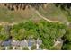 Aerial view shows homes in a beautiful area close to a golf course at 7035 W Mountain Xing, Cumming, GA 30041