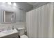 Powder room features a vanity with sink and neutral walls at 7035 W Mountain Xing, Cumming, GA 30041