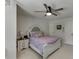 Cozy bedroom features a ceiling fan, nightstand, and a stylish white wood bed frame at 7035 W Mountain Xing, Cumming, GA 30041
