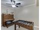 Game room with a foosball table and piano at 7035 W Mountain Xing, Cumming, GA 30041