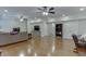 Spacious living room with hardwood floors, neutral paint, recessed lights, and lots of natural light at 7035 W Mountain Xing, Cumming, GA 30041