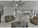 Beautiful living room with stylish decor, an open floor plan, and a direct view of the modern kitchen at 7035 W Mountain Xing, Cumming, GA 30041
