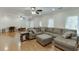 Spacious living room with hardwood floors, recessed lighting, ceiling fans and lots of windows at 7035 W Mountain Xing, Cumming, GA 30041