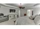 Bright main bedroom boasts a tray ceiling and a media center, with a bathroom and walk-in closet at 7035 W Mountain Xing, Cumming, GA 30041