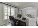 Office with large window, natural light, desk, and access to formal dining room at 7035 W Mountain Xing, Cumming, GA 30041