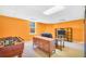 Spacious basement featuring a games table, comfortable seating and a modern TV setup at 8870 Dornoch Cir, Winston, GA 30187