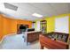 Spacious basement featuring a games table, comfortable seating and a modern TV setup at 8870 Dornoch Cir, Winston, GA 30187