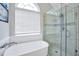 Bright bathroom featuring a standalone tub and a glass shower with a tiled surround at 8870 Dornoch Cir, Winston, GA 30187