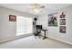 Bedroom with ceiling fan, desk, and natural light at 8870 Dornoch Cir, Winston, GA 30187